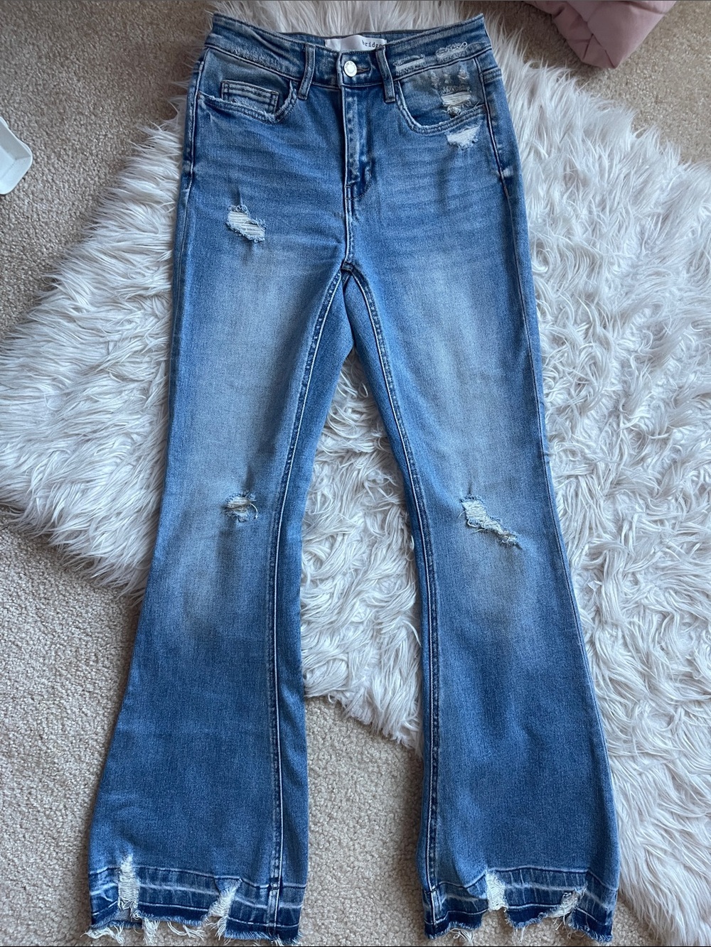 Women’s Distressed Blue Flared Jeans – High-Rise Stretch